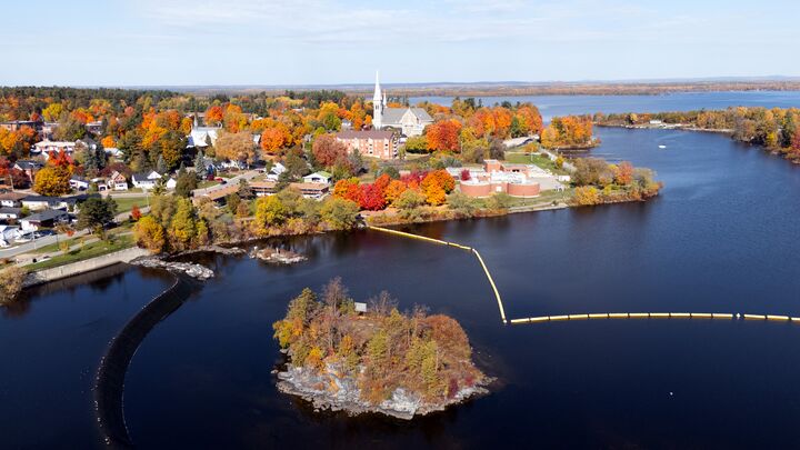 Lakeside town in full autumn colour, with a church steeple
